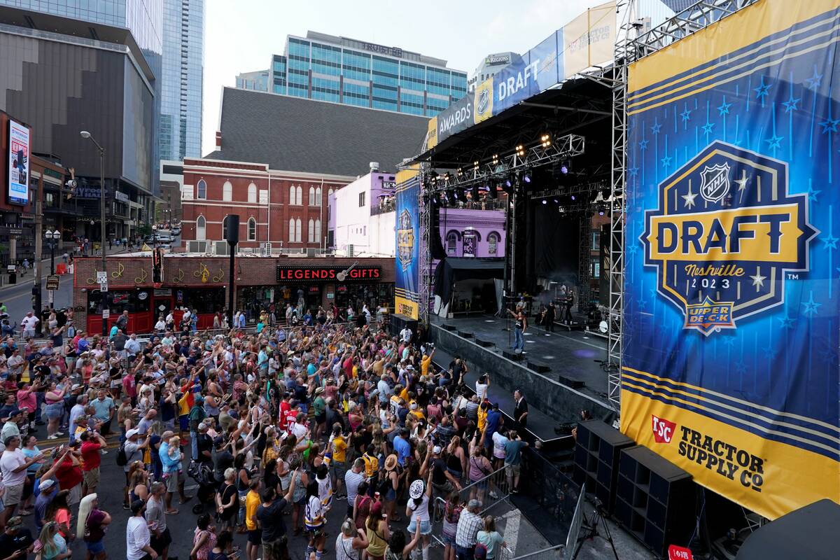 Fans listen to the music of Jo Dee Messina before the first round of the NHL hockey draft, Wedn ...