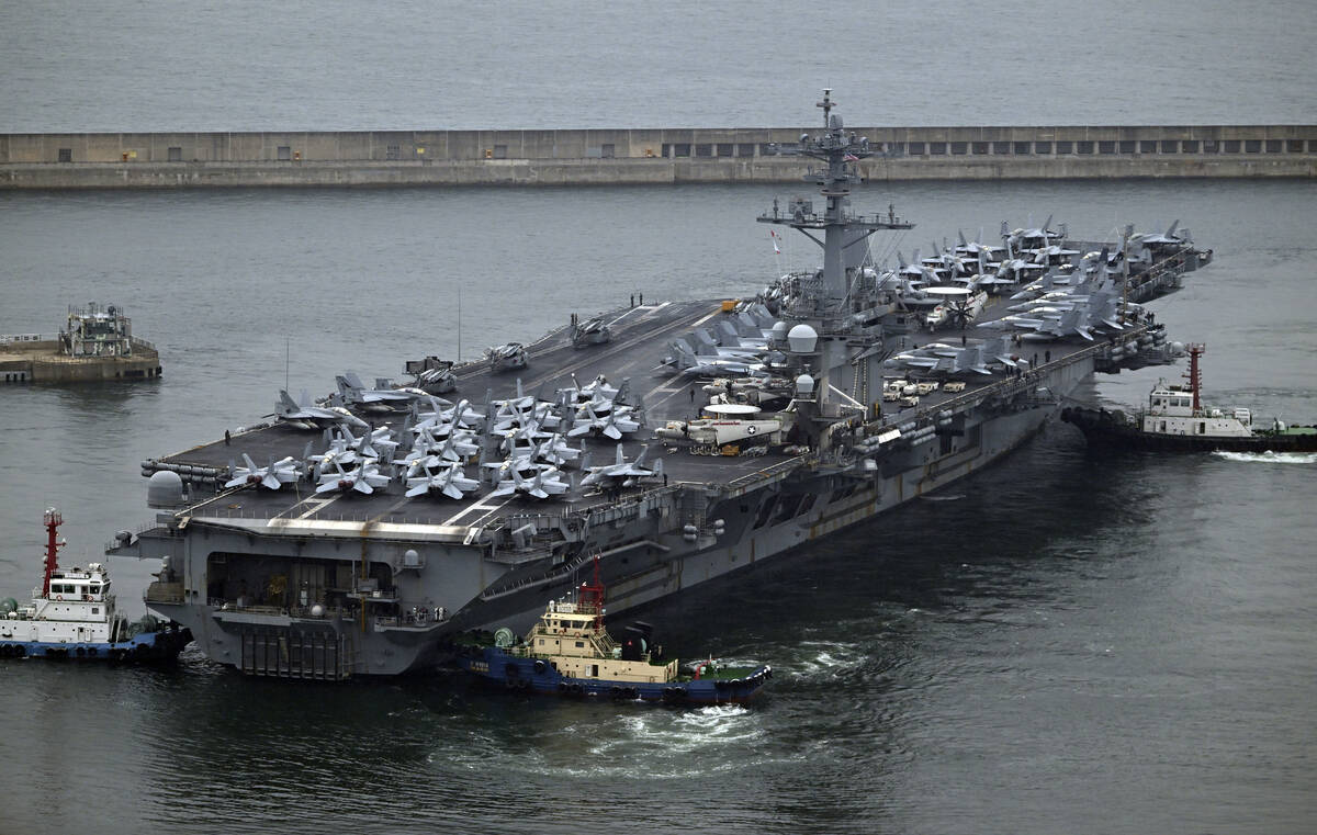The Theodore Roosevelt (CVN 71), a nuclear-powered aircraft carrier is anchored in Busan, South ...