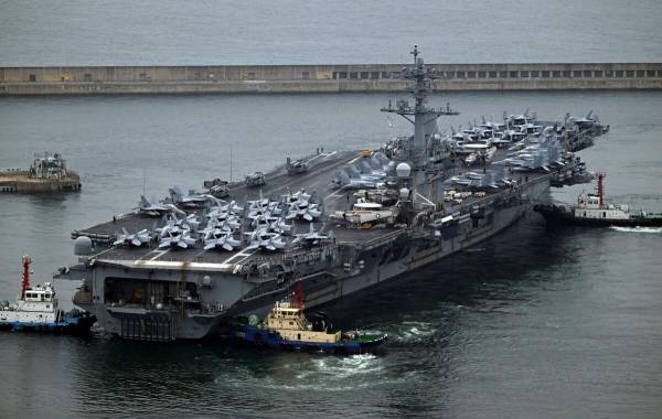 The Theodore Roosevelt (CVN 71), a nuclear-powered aircraft carrier is anchored in Busan, South ...