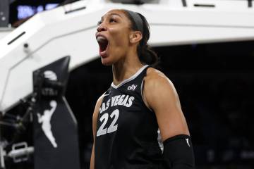 Las Vegas Aces center A'ja Wilson (22) celebrates after scoring and drawing a foul from the Con ...