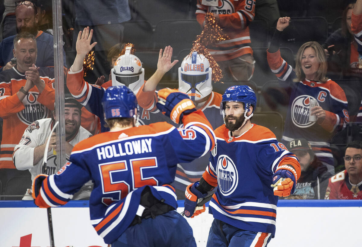 Edmonton Oilers' Dylan Holloway (55) and Adam Henrique (19) celebrate a goal against the Florid ...