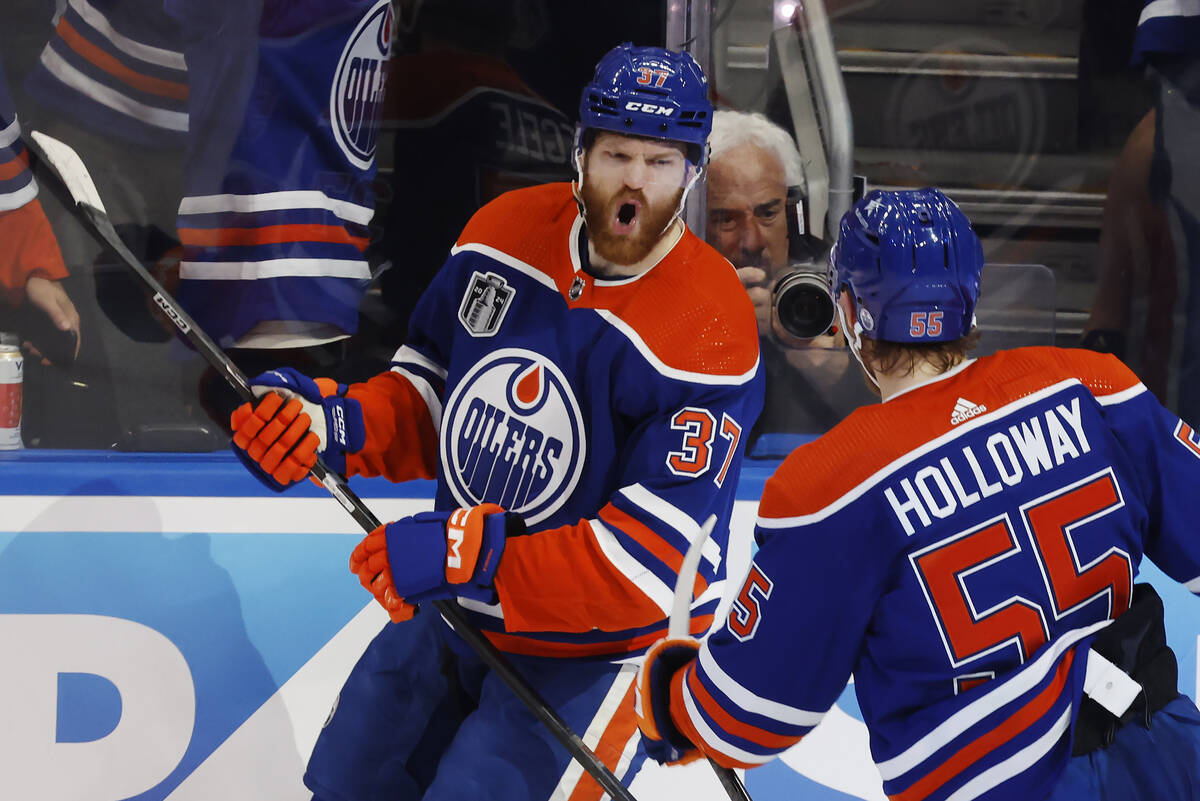 Edmonton Oilers' Warren Foegele (37) celebrates his goal against the Florida Panthers with Dyla ...