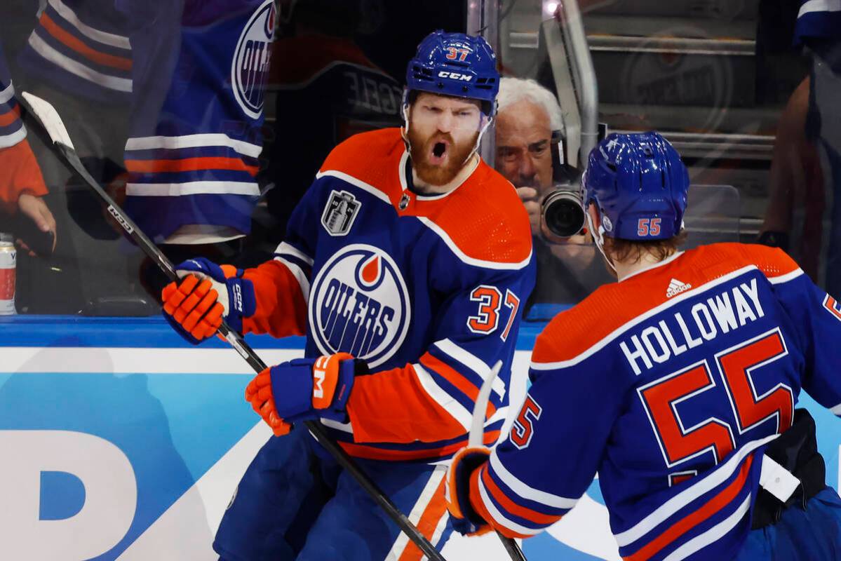 Edmonton Oilers' Warren Foegele (37) celebrates his goal against the Florida Panthers with Dyla ...