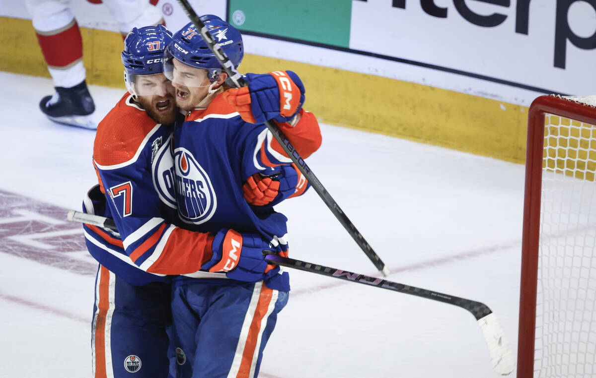 Edmonton Oilers' Ryan McLeod (71) celebrates his goal against the Florida Panthers with Warren ...