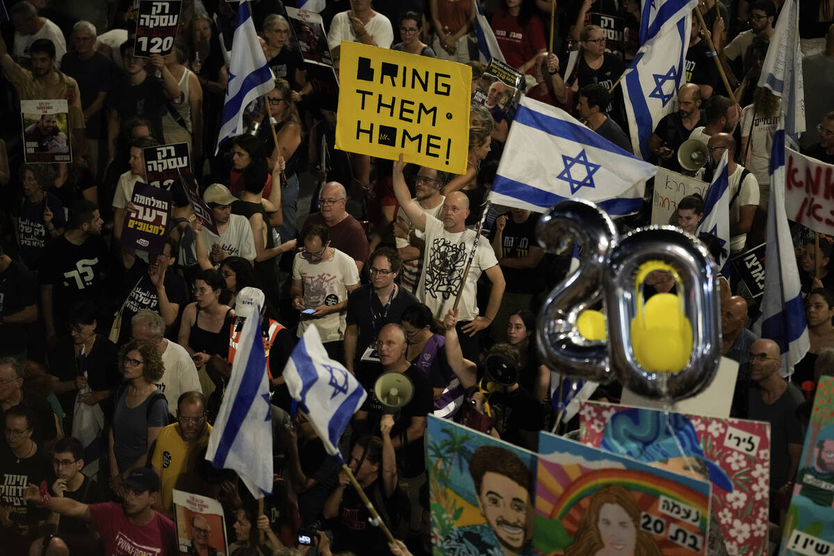 People protest against Israeli Prime Minister Benjamin Netanyahu's government and call for the ...