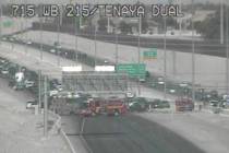 Police and fire crews work a wrong-way crash on the 215 Beltway near Jones Boulevard that kille ...