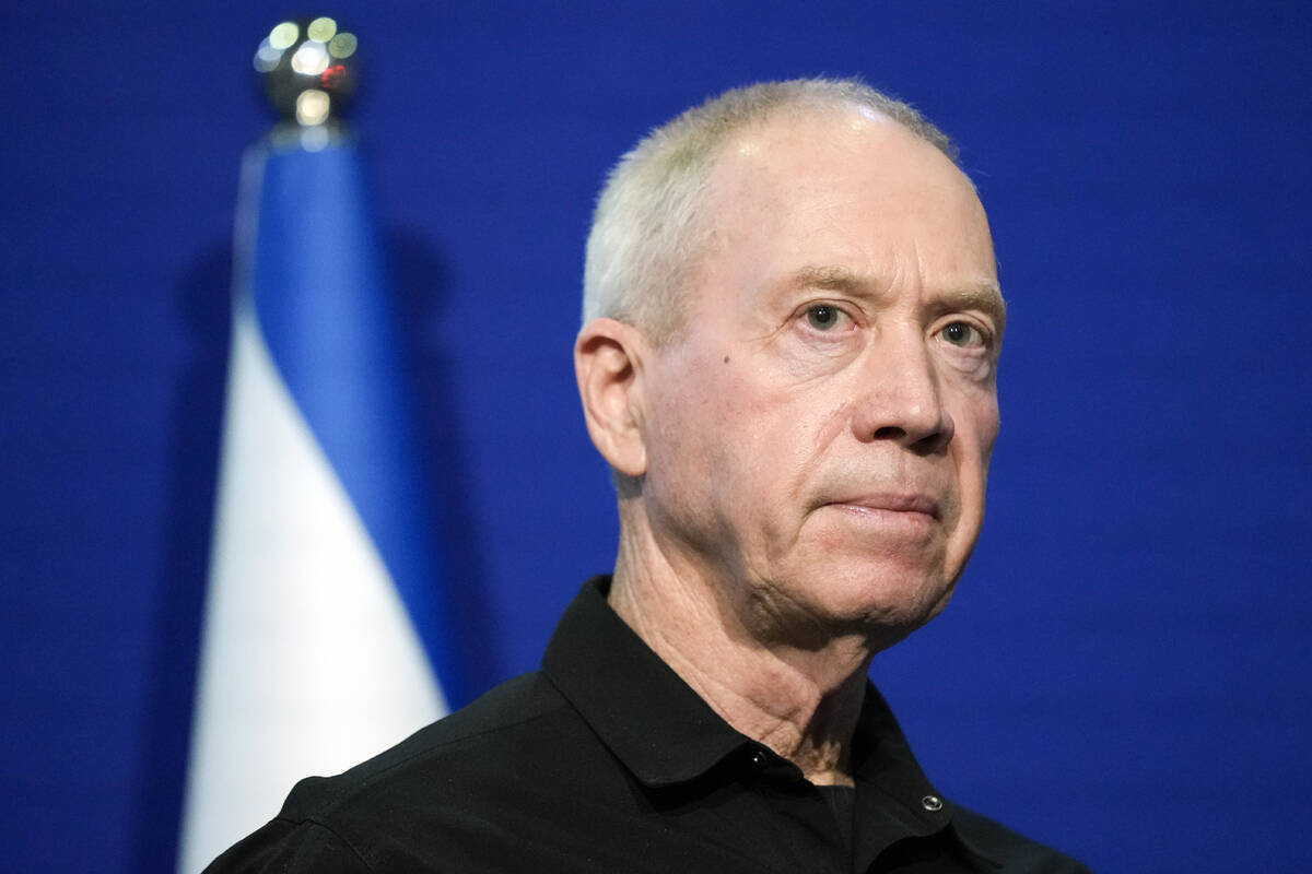 Israeli Defense Minister Yoav Gallant pauses while making a brief statement to the media with U ...