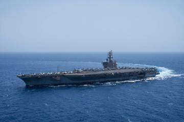 The USS aircraft carrier Dwight D. Eisenhower, also known as 'IKE', sails in the Red Sea on Wed ...