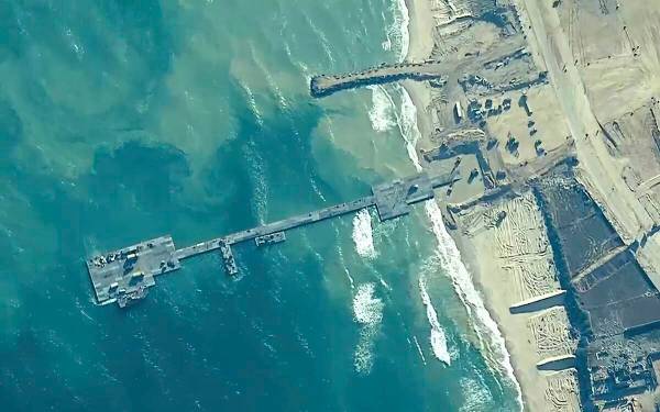 FILE - This image provided by U.S. Central Command, shows the U.S.-built floating pier being us ...