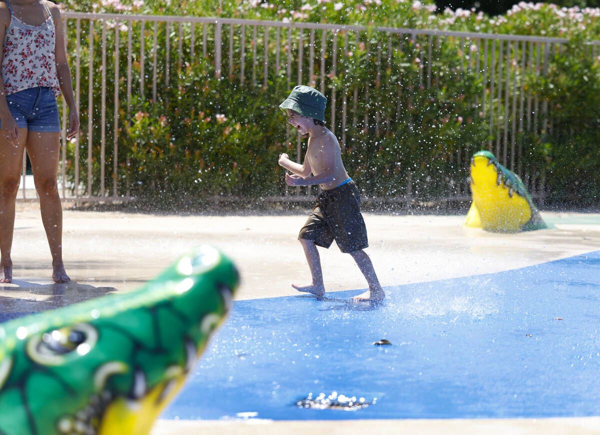 Garrus Williams, 4, plays in the splash pad at Aliante Nature Discovery Park, on Monday, June 2 ...
