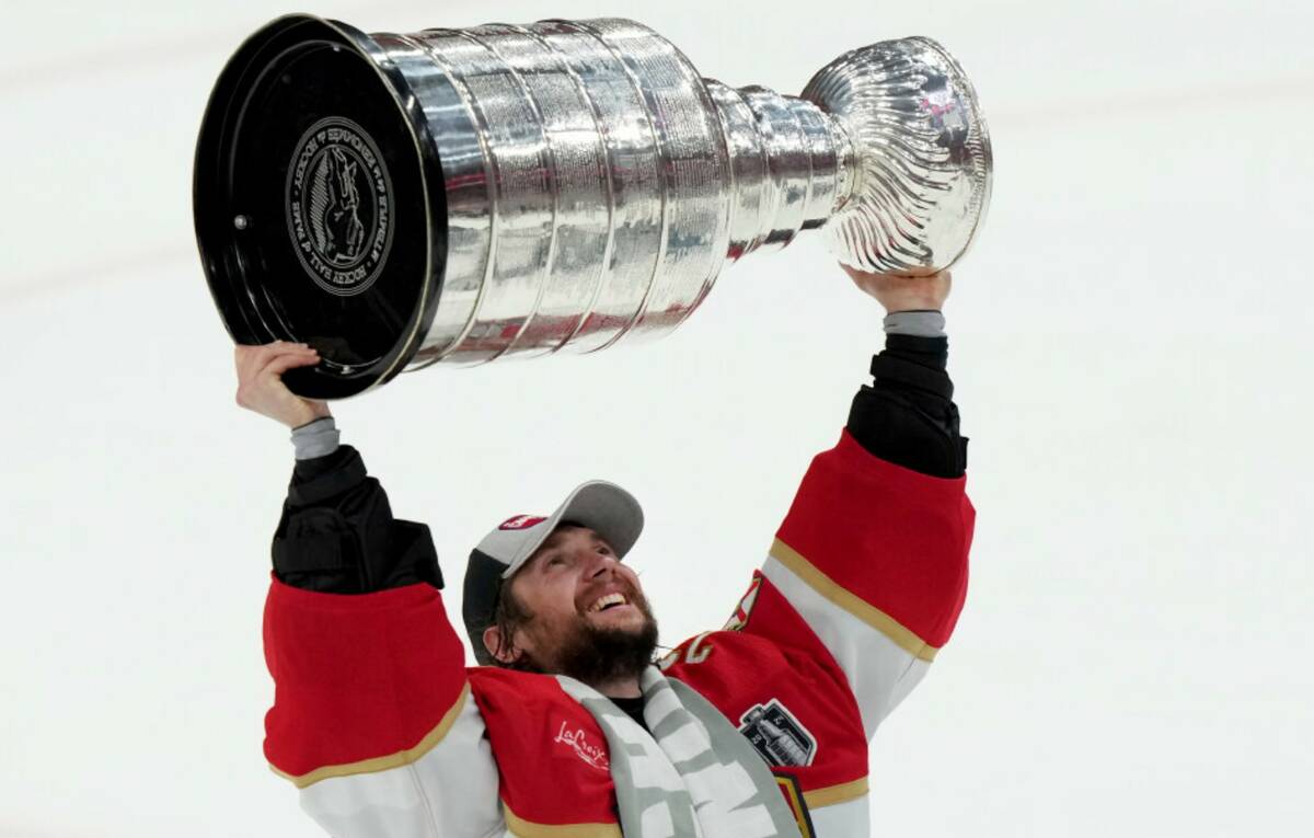 Florida Panthers goaltender Sergei Bobrovsky hoists the NHL hockey Stanley Cup after defeating ...