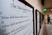 A copy of the Ten Commandments is posted along with other historical documents in a hallway of ...