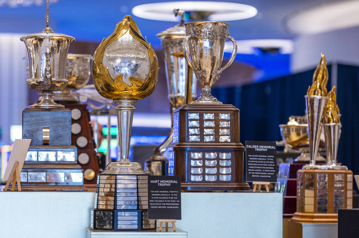The Hart Memorial Trophy, left center, is one the 18 NHL trophies on display as the awards even ...