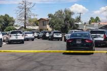 Las Vegas police investigate the scene of an officer-involved shooting in the 2000 block of Val ...