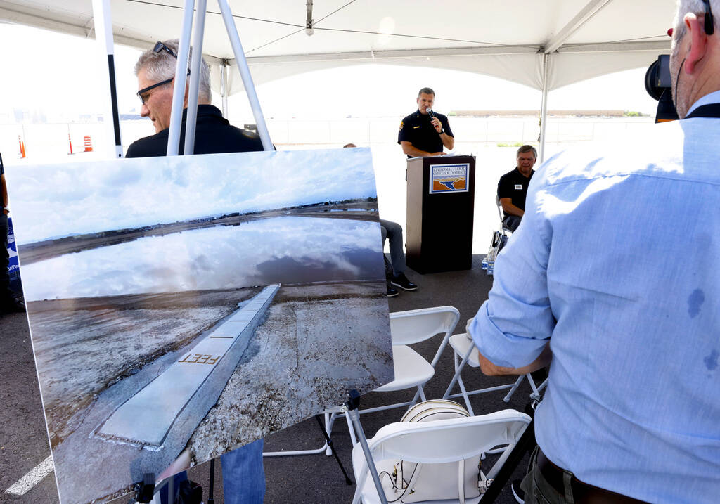 A photograph of the Tropicana detention basin, a part of the flood control system, is displayed ...