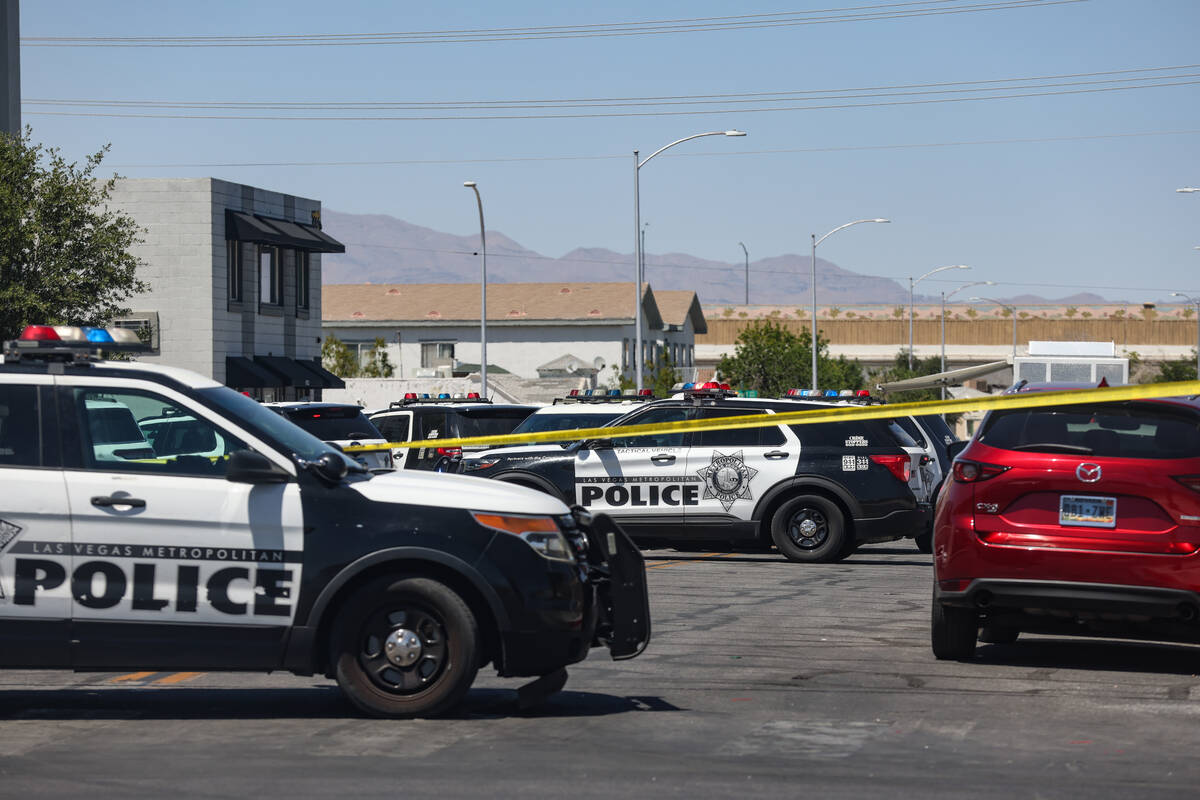 Police near the scene of an officer-involved shooting on Ninth Street in Downtown Las Vegas, Th ...