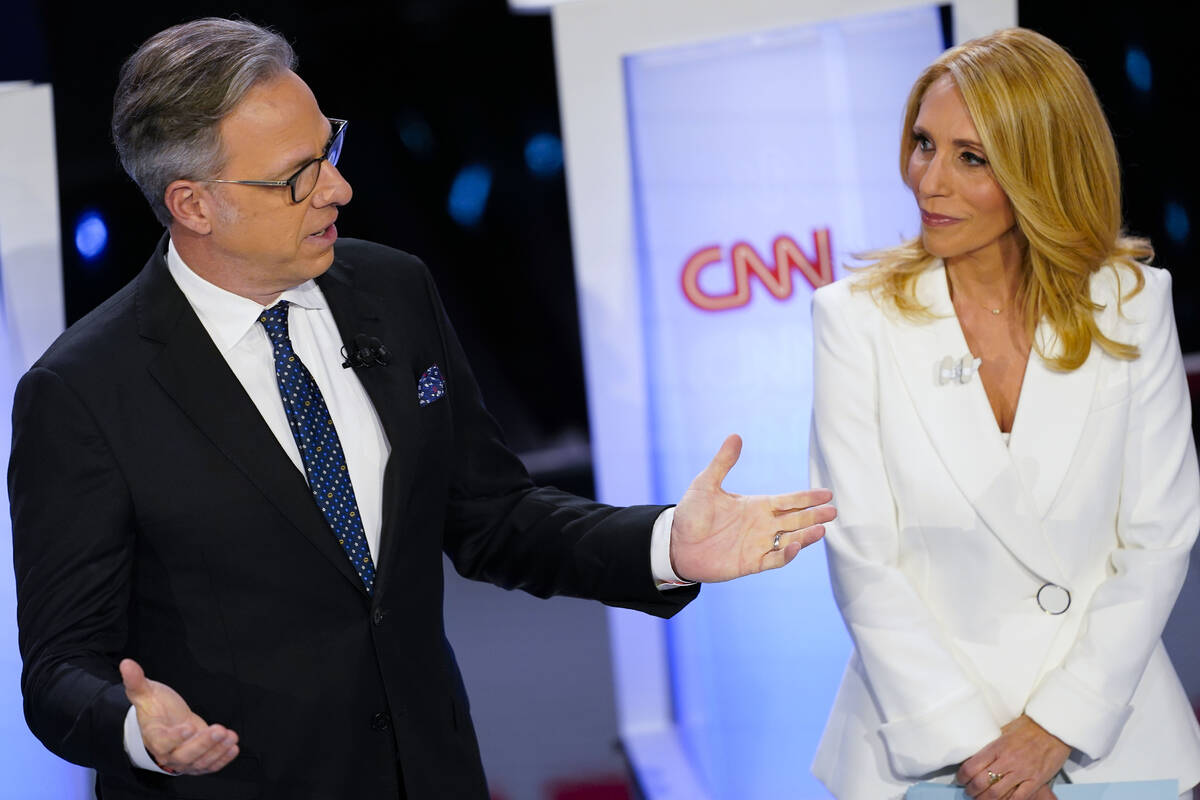 FILE - CNN anchors Jake Tapper, left, and Dana Bash, right, speaking to members of the audience ...