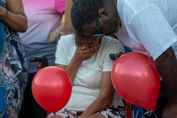 Kayla Harris’ grandmother mourns the loss of her granddaughter during a candlelight vigil at ...
