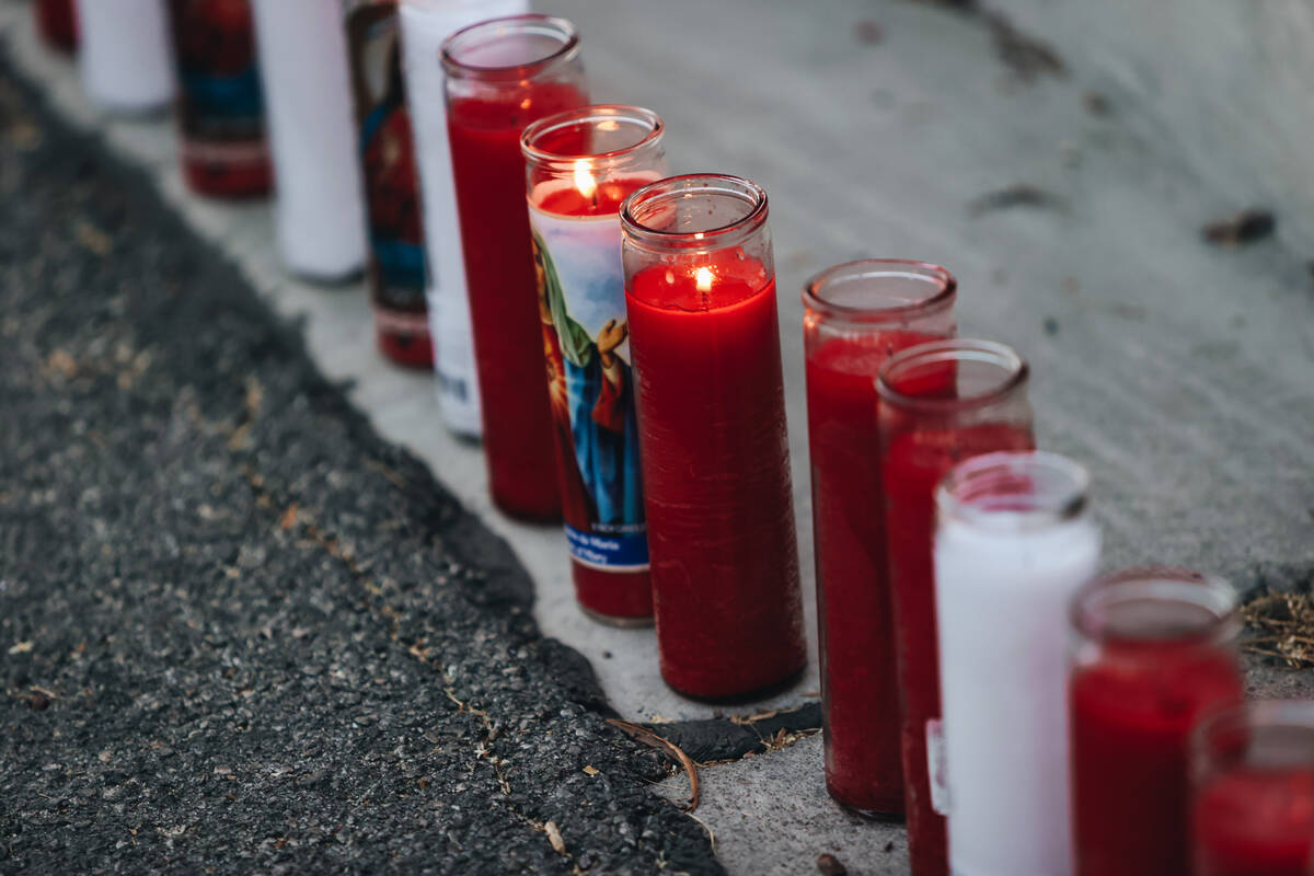 Candles are seen during a vigil for Kayla Harris, who was killed in a quintuple homicide on Jun ...