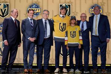 David Edstrom, center, poses with Vegas Golden Knights officials after being picked by the team ...