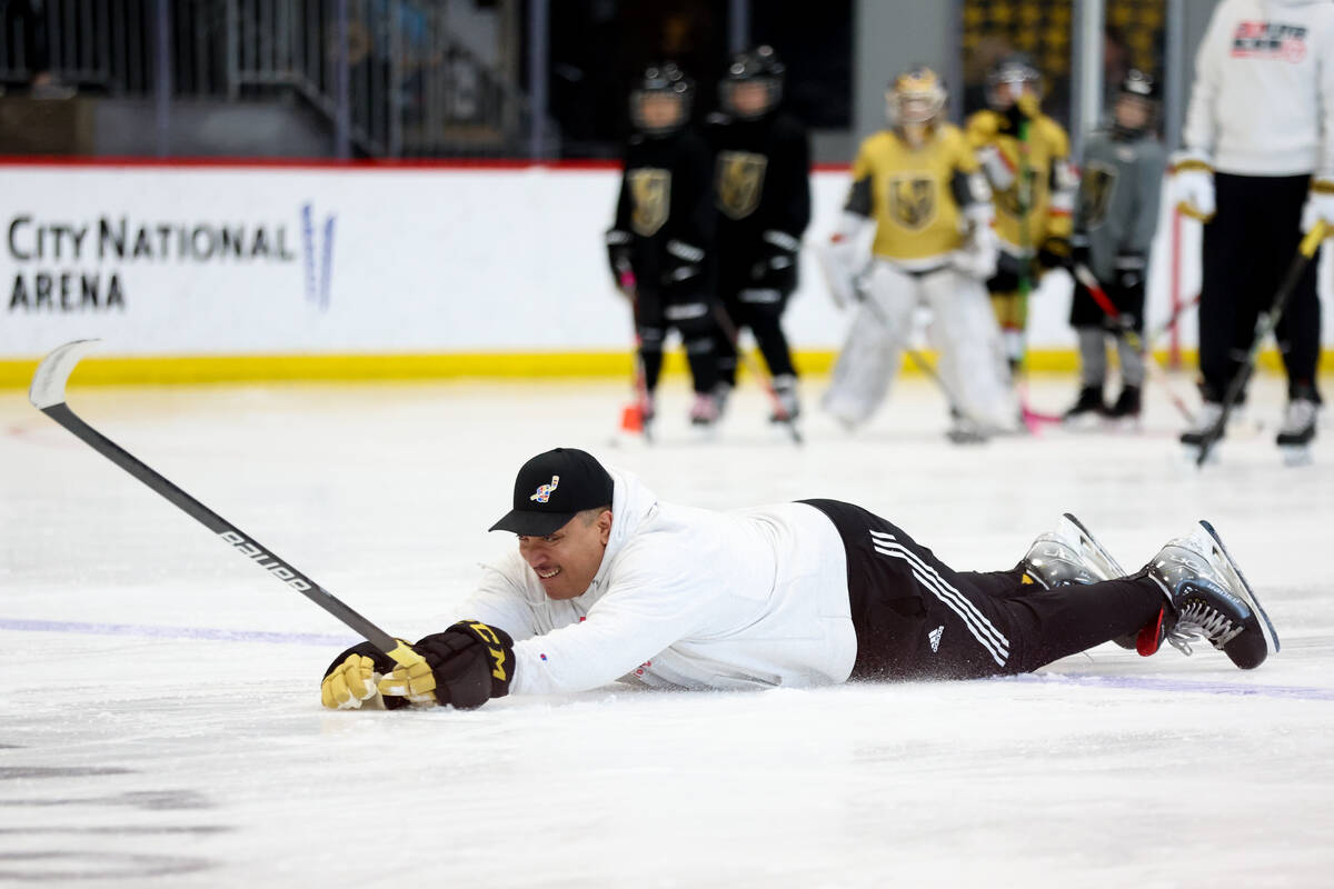Former professional hockey player Anthony Stewart demonstrates diving to the ice during the NHL ...