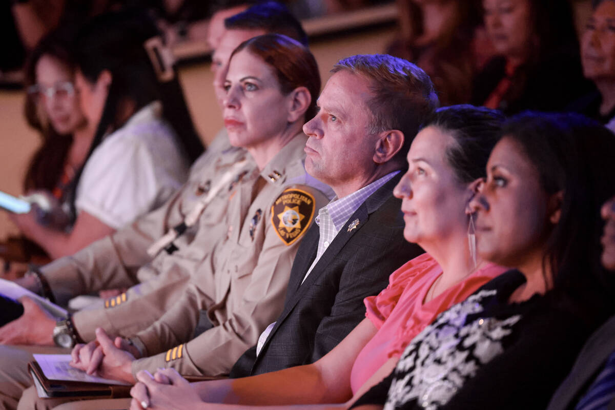 Las Vegas police, including Clark County Sheriff Kevin McMahill, third from right, and members ...