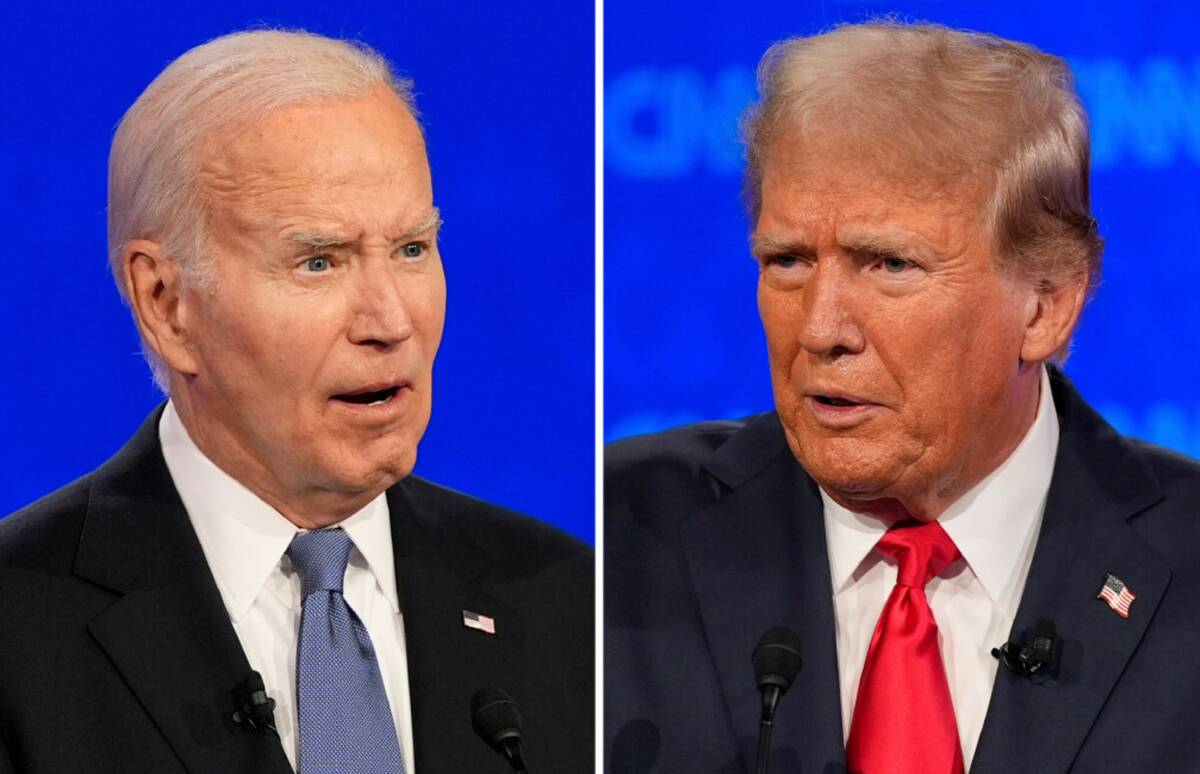 Donald Trump, left, and President Joe Biden talk during a presidential debate hosted by CNN, Th ...