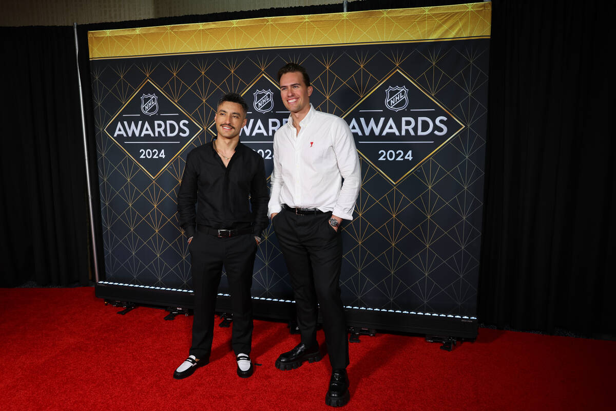 Joe Depace, left, and Andrew Fedyk, DJ duo Loud Luxury, pose on the red carpet before the NHL A ...
