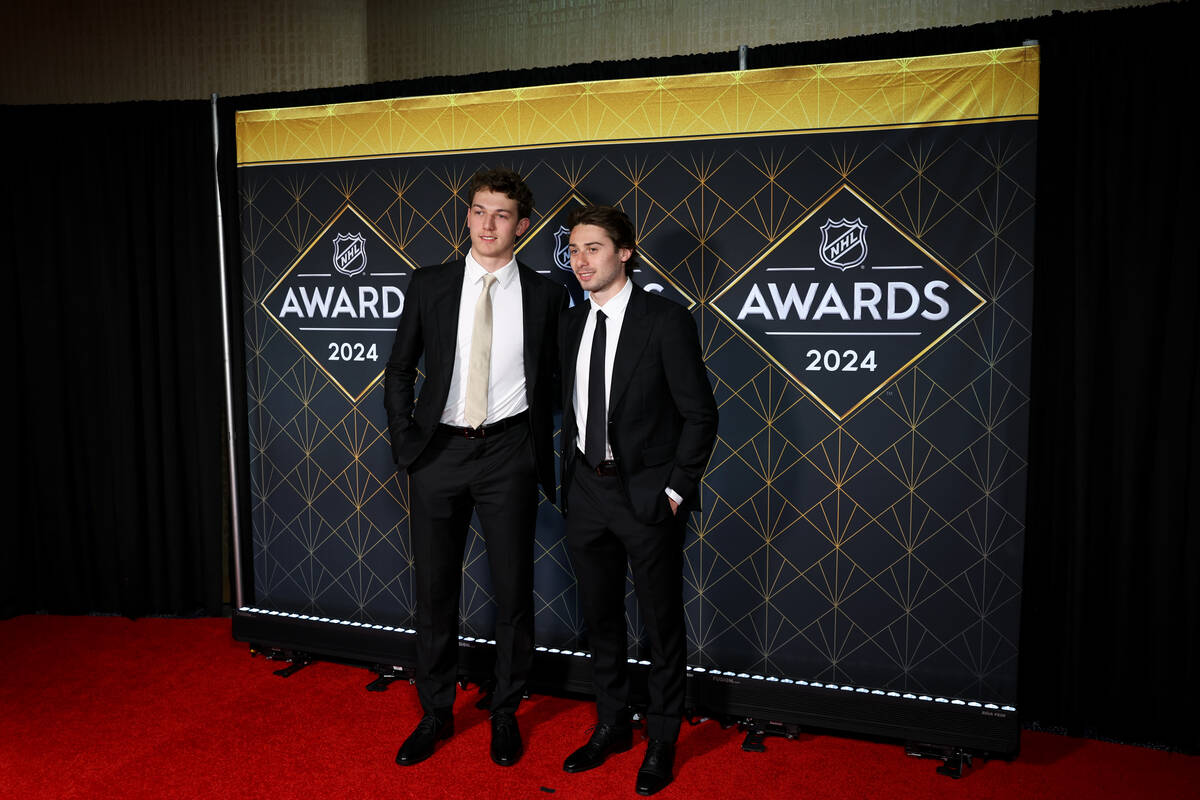Brothers Luke Hughes, left, of the New Jersey Devils, and Quinn Hughes, of the Vancouver Canuck ...
