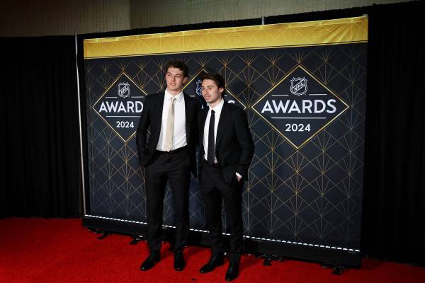 Brothers Luke Hughes, left, of the New Jersey Devils, and Quinn Hughes, of the Vancouver Canuck ...