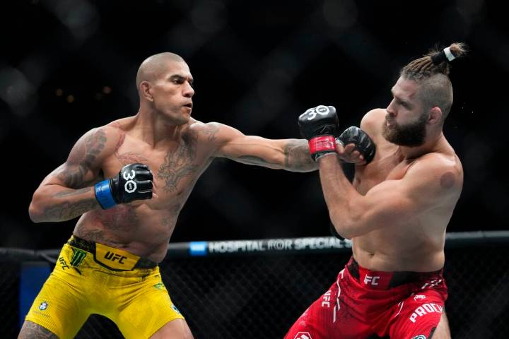 Brazil's Alex Pereira, left, punches Czech Republic's Jiri Prochazka during the second round of ...