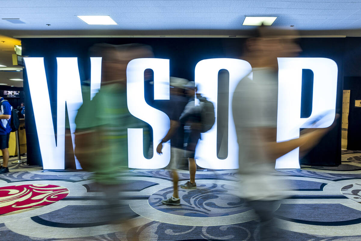 Attendees stream about during the final starting flight of World Series of Poker $10,000 buy-in ...