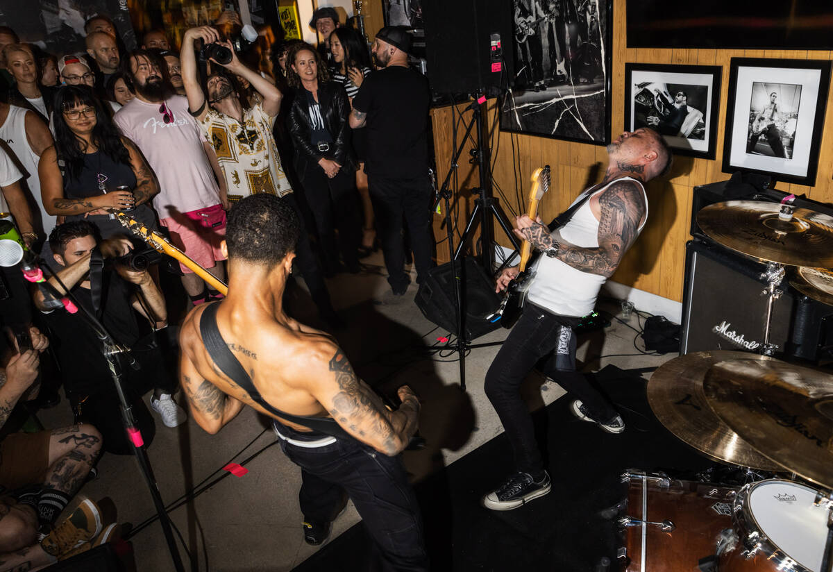 Tim Stewart, left, and Jonny Goood, of Damnage, right, perform at the Punk Rock Museum on Frida ...