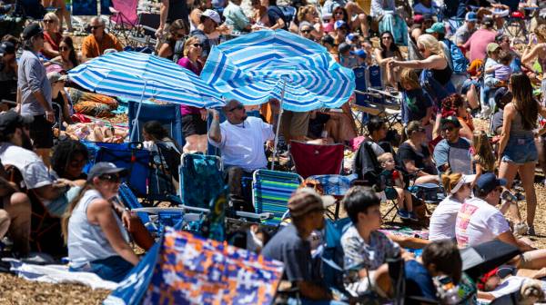 The wind whips up to upturn an umbrella during the Mountain Fest on Rabbit Peak at Mount Charle ...