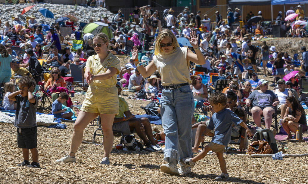 People dance near the stage during the Mountain Fest on Rabbit Peak at Mount Charleston on Satu ...