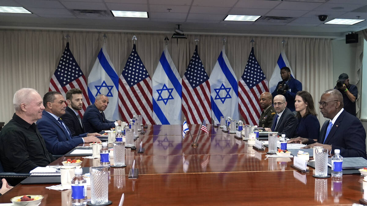 Defense Secretary Lloyd Austin, right, and Israeli Defense Minister Yoav Gallant, second from l ...