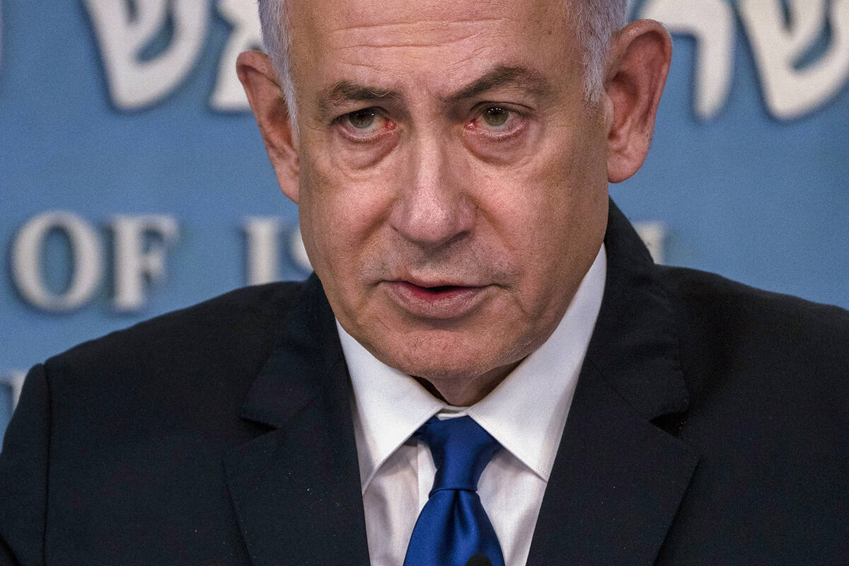 Israeli Prime Minister Benjamin Netanyahu speaks during a joint press conference with the Germa ...