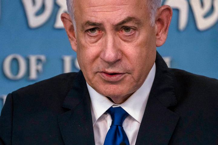 Israeli Prime Minister Benjamin Netanyahu speaks during a joint press conference with the Germa ...