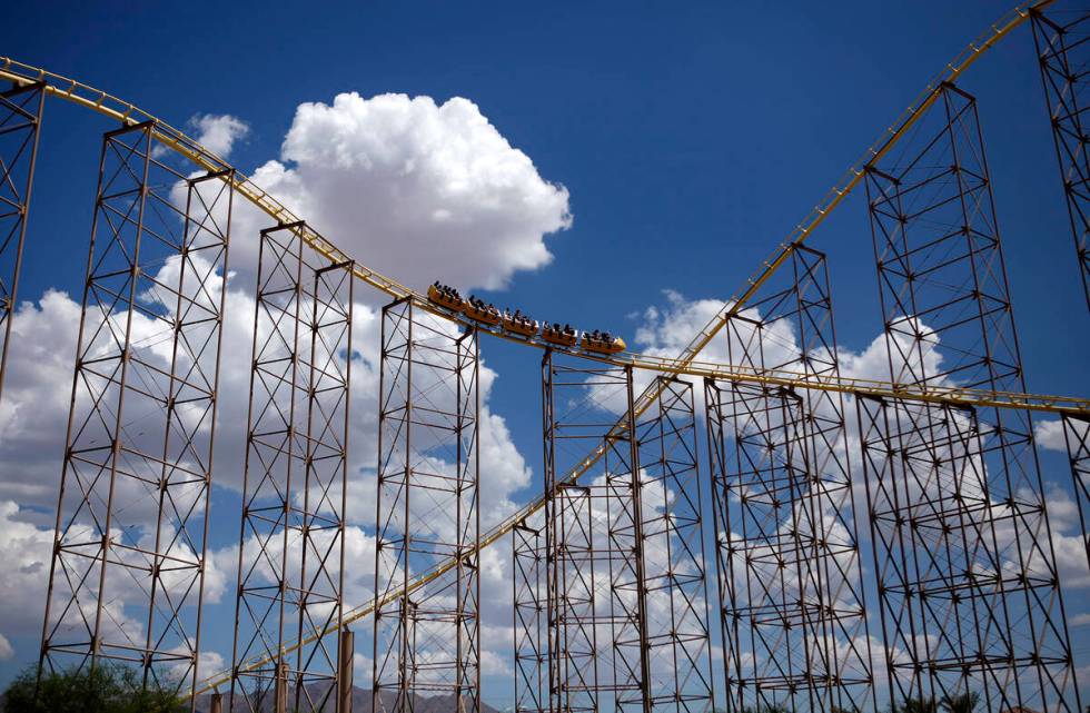 People ride The Desperado roller coaster at Buffalo Bill's in Primm, Nev. Friday, Aug. 16, 2013 ...