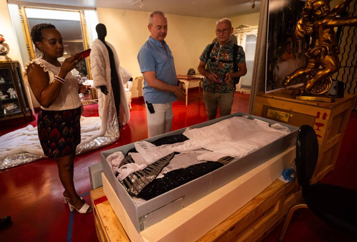 Jonathan Warren, chairman of the Liberace Foundation, opens a box with one of Liberace’s ...