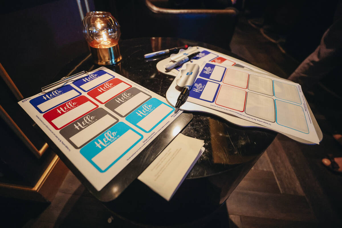 Name tags sit out for attendees during a Scared to Sale social event at Eight Cigar Lounge on T ...