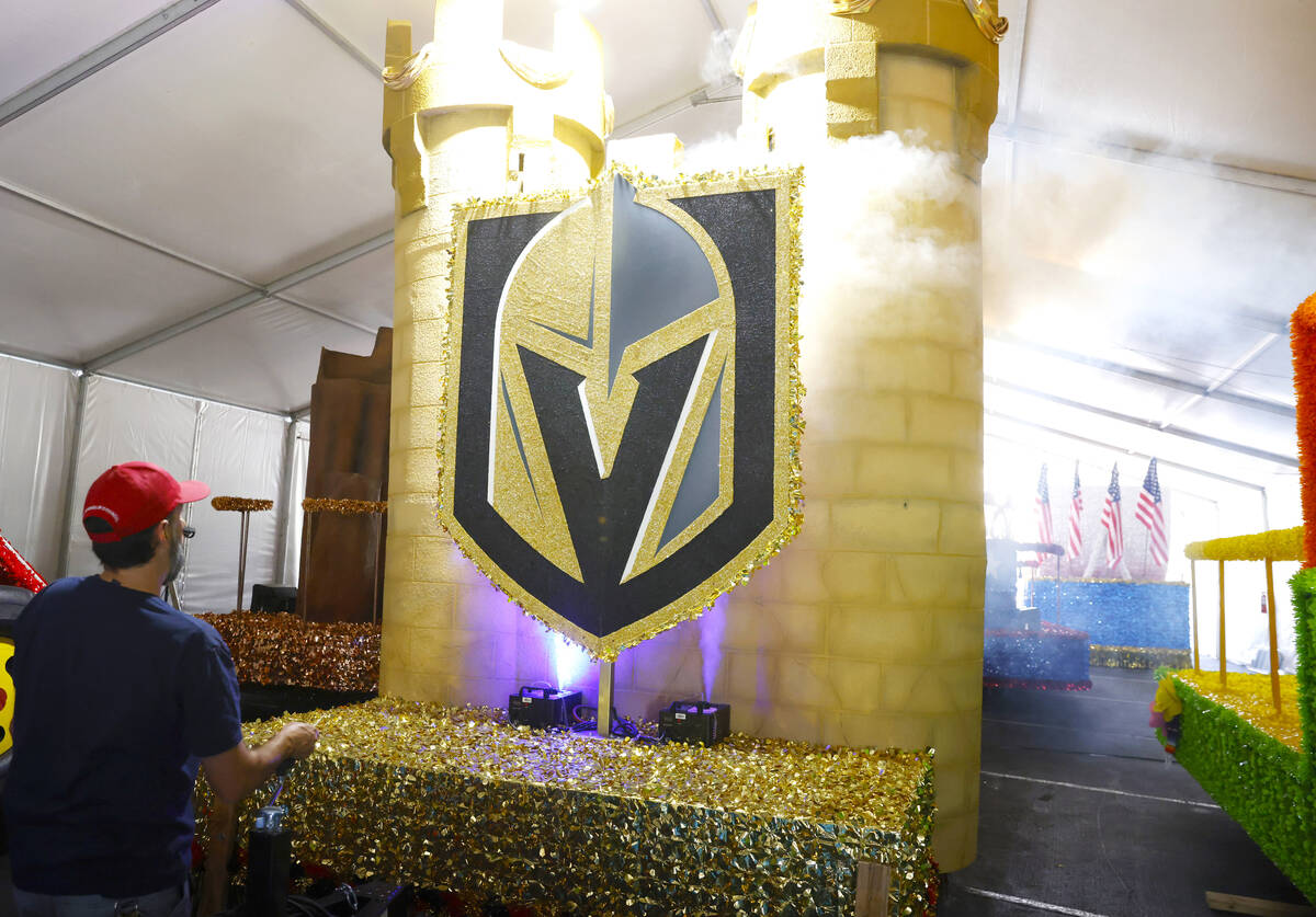 Dave Bailey, a volunteer, tests the fog machine on the “Vegas Golden Knights” flo ...