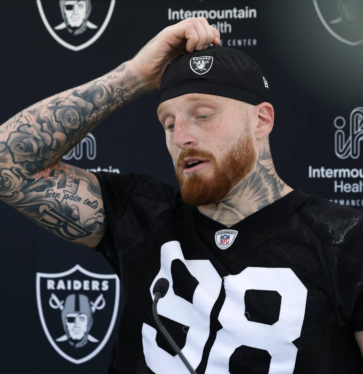 Raiders defensive end Maxx Crosby (98) pauses as he addresses the media after an NFL football p ...