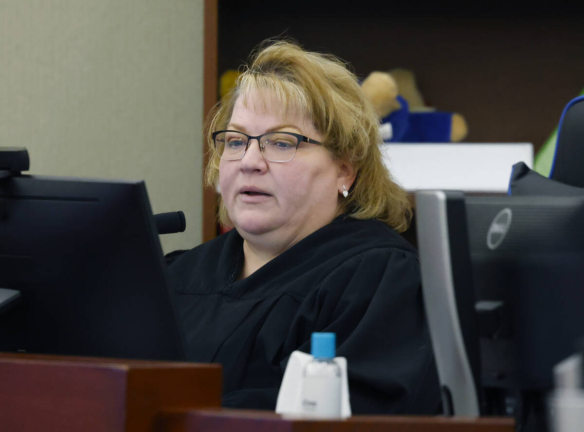 District Court Judge Dawn Throne presides over a hearing extending temporary guardianship of ch ...