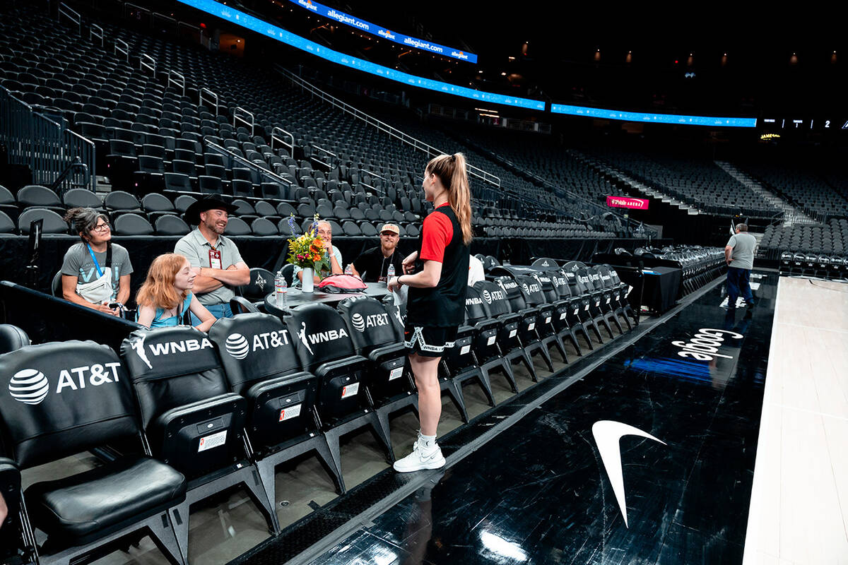 Las Vegas Aces rookie guard Kate Martin talk to Bailey Lux and family during practice Monday, J ...