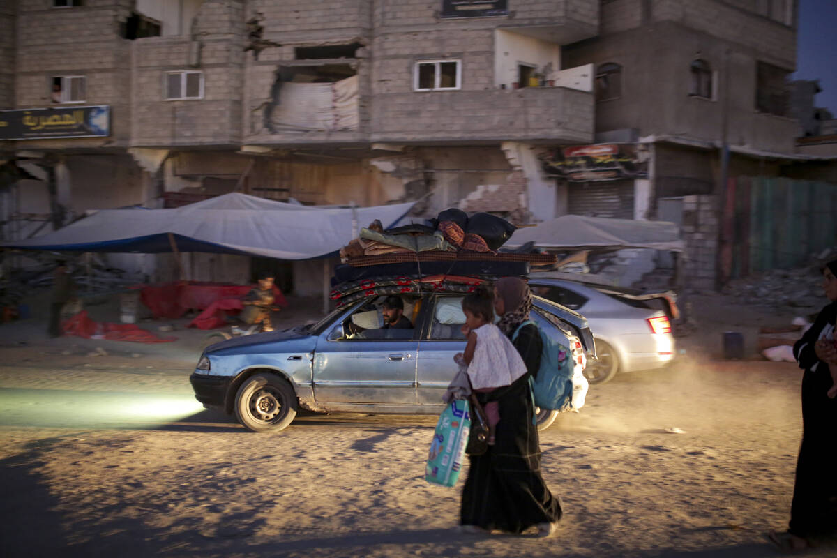 Palestinians displaced by the Israeli air and ground offensive on the Gaza Strip flee from part ...