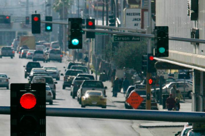 Red and green traffic lights are seen on Main Street in downtown Las Vegas. (Review-Journal file)