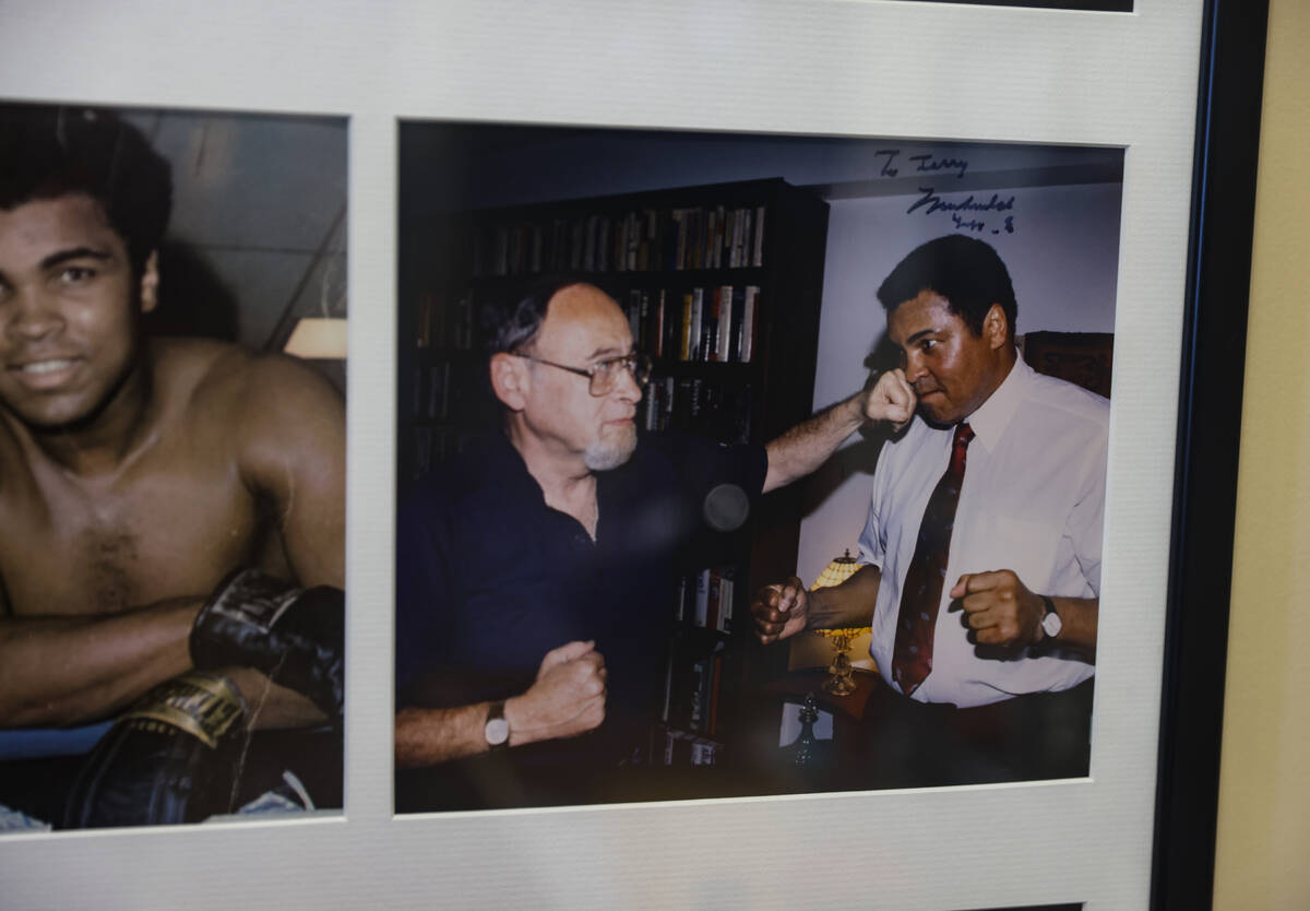 A photo of sportswriter Jerry Izenberg pretending to fight with Muhammad Ali at his home in Hen ...