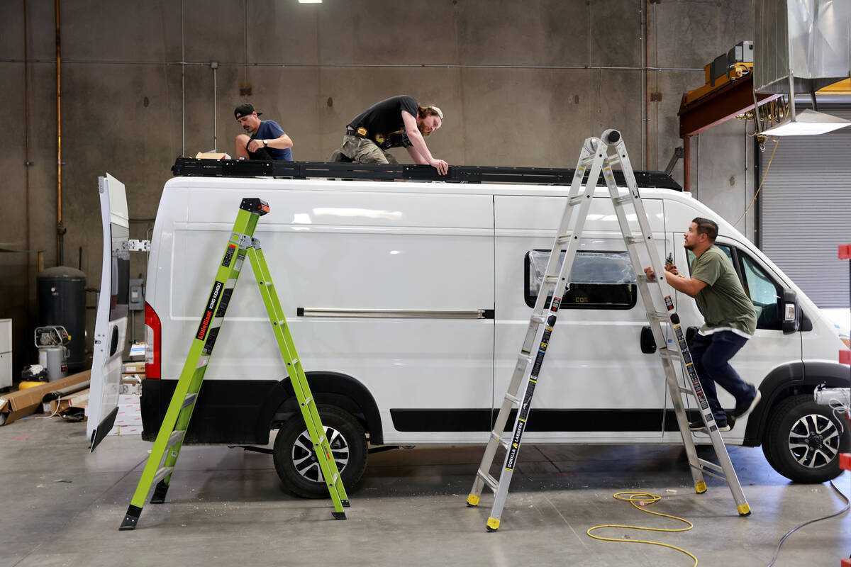 Workers convert a van into a mobile home at Noovo manufacturing facility in Las Vegas Thursday, ...