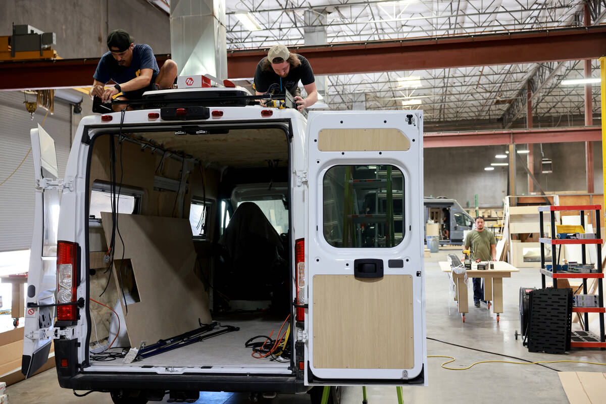 Workers convert a van into a mobile home at Noovo manufacturing facility in Las Vegas Thursday, ...